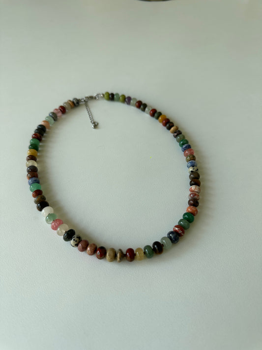 Multicolored beaded necklace on a white background