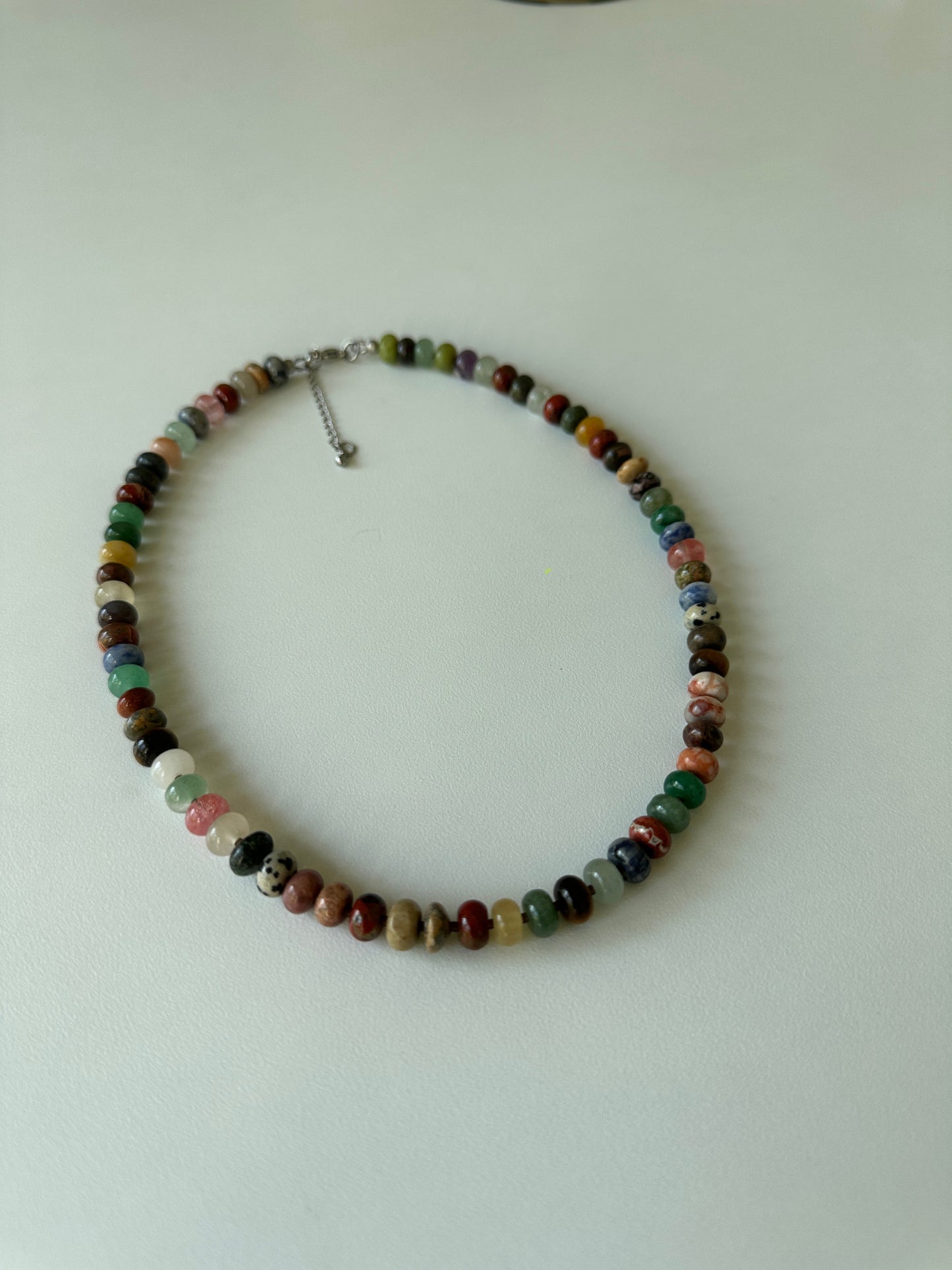 Multicolored beaded necklace on a white background