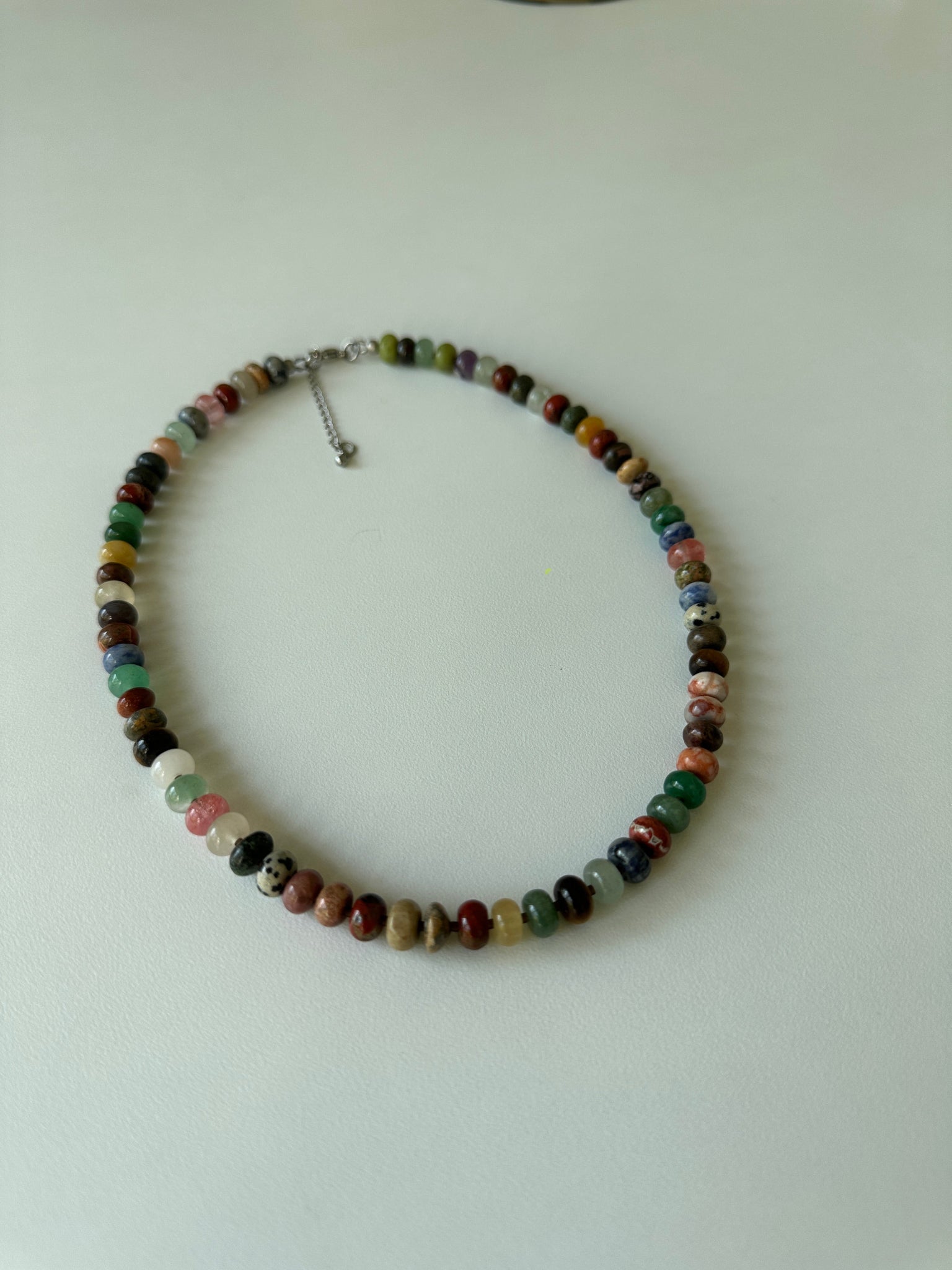Multicolored beaded necklace on a white background