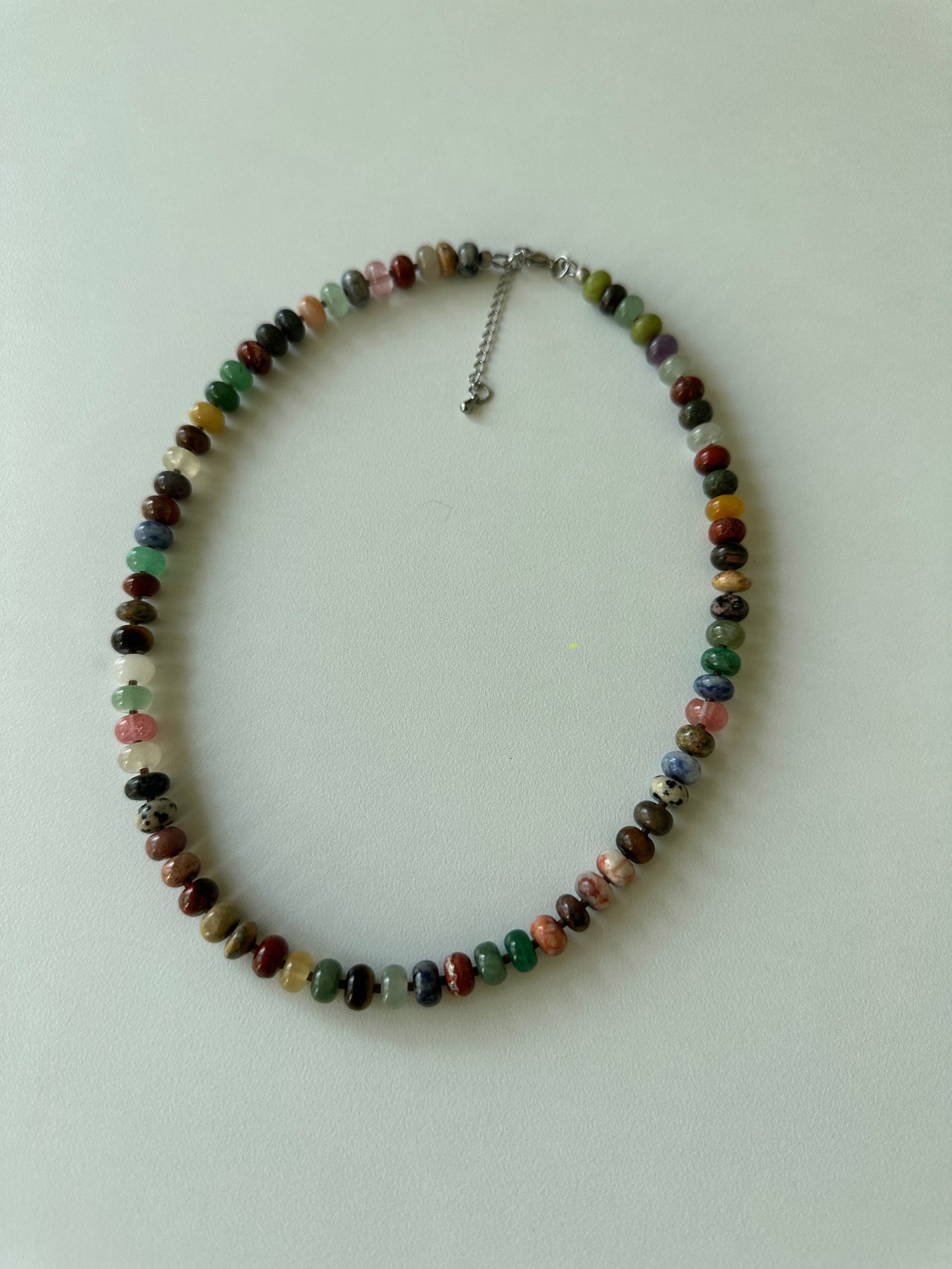 Multicolored beaded necklace on a white background